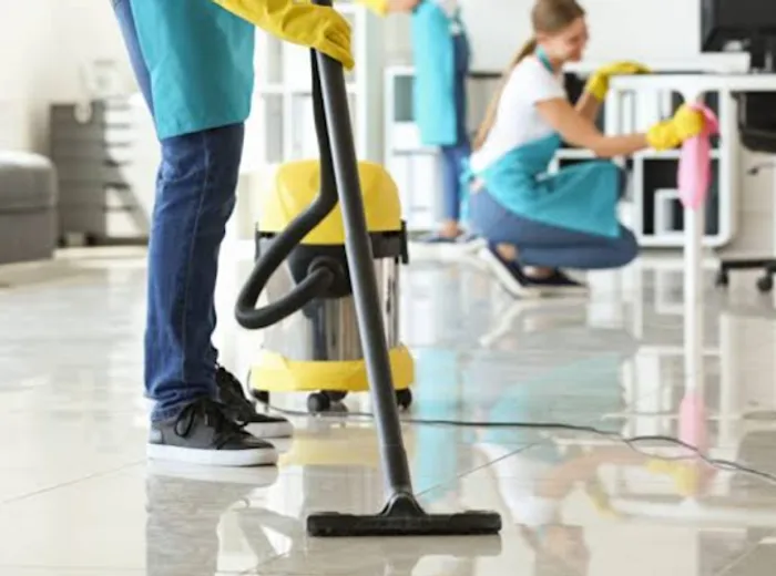 A Concierge BNB Cleaners team member vacuuming a property